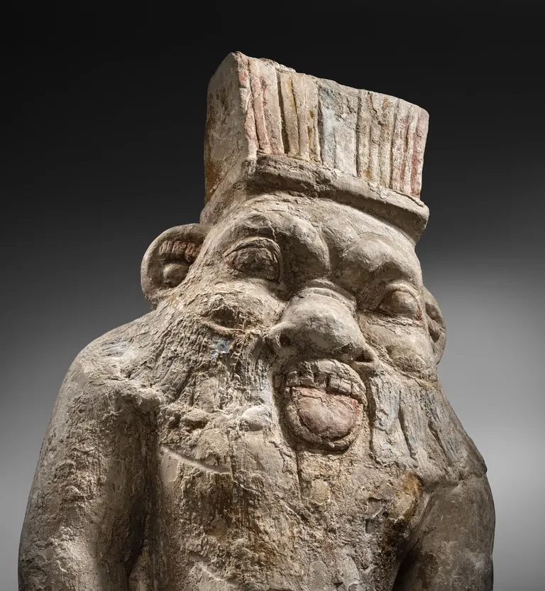 Painted limestone statue of the god Bes, Ptolemaic period (MEB E-433)