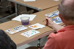 Participants in The Phillips Collection's Reframing Care programme making artwork together