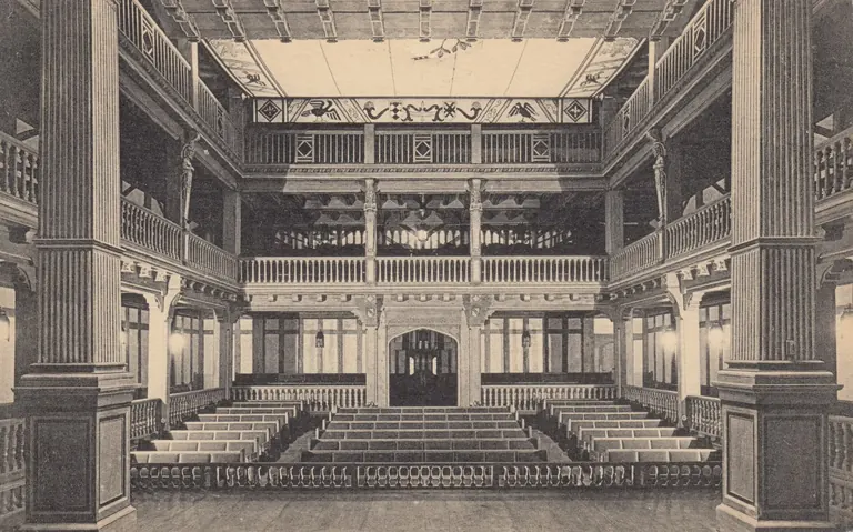 The Elizabethan Theatre at the Folger Shakespeare Library, showing its tiered wooden balconies and half-timbered facade