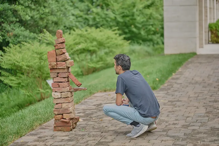Joey Enriquez, unrepresented but present, 2022, found brick, license plate, fence and metal
