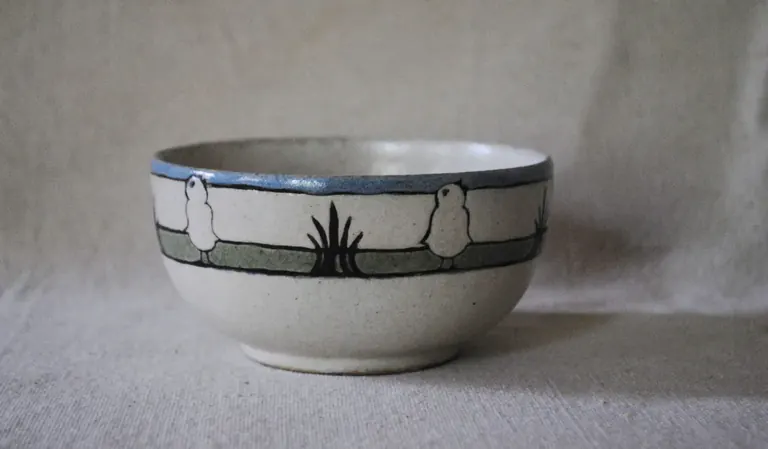 Saturday Evening Girls pottery bowl decorated with painted stripes and wheat stalks, from the Paul Revere House collection