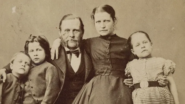 Informal 1860s portrait of an unknown family with three children