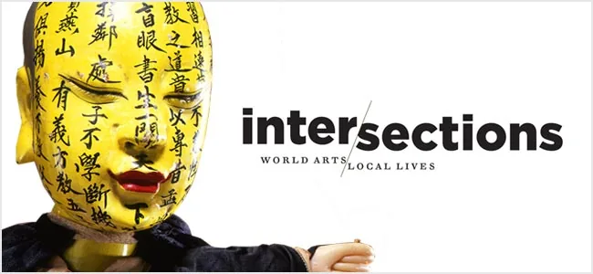 رأس دمية أصفر يحمل حروفًا صينية، من معرض Intersections