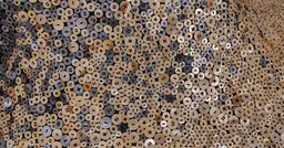Detail of hand-sewn mother-of-pearl buttons from Nick Cave's Louder Still, 2025