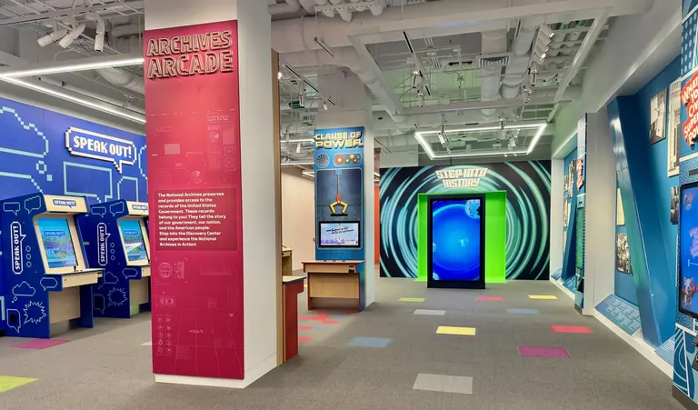 Children playing interactive civics games in the Discovery Center at the National Archives Museum