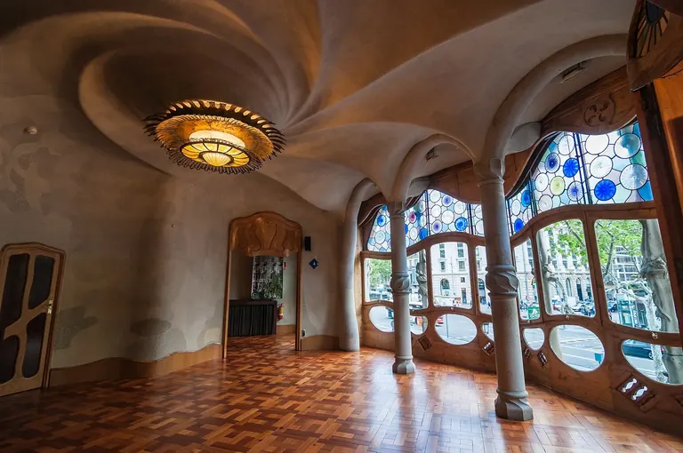 Main salon on the Noble Floor of Casa Batlló, with its swirling ceiling and stained-glass windows