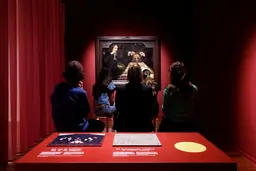 Visitors in the slow-looking room in front of Rembrandt's The Anatomy Lesson of Jan Deijman