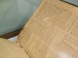 Display cases of rare books and printed material in the Imagined Nation installation at the Boston Athenæum
