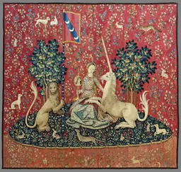The Sight panel of the Lady and the Unicorn tapestry, the unicorn gazing into a mirror