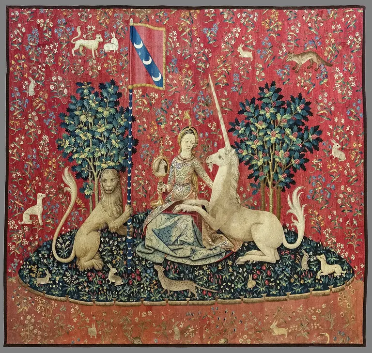 The Sight panel of the Lady and the Unicorn tapestry, the unicorn gazing into a mirror