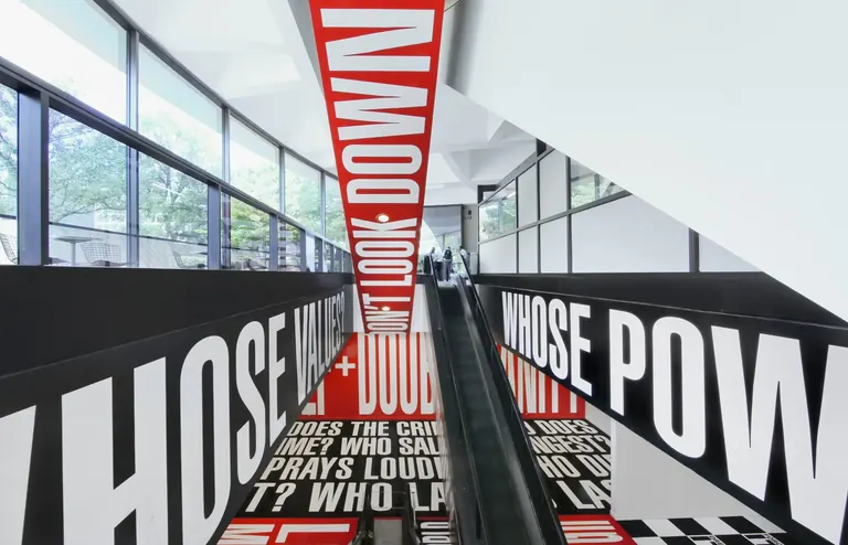 Barbara Kruger's Belief+Doubt vinyl text installation on the escalator and walls of the Hirshhorn's lower lobby
