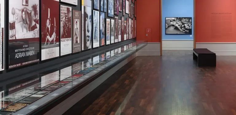 Exhibition view of Intermezzo with the wall of Helmut Newton exhibition posters
