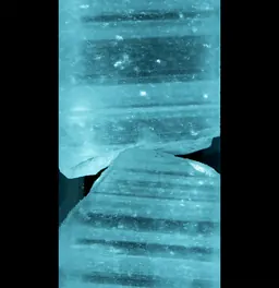 Still from Peggy Weil's 88 Cores showing a Greenland ice core