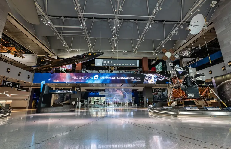 The Boeing Milestones of Flight Hall, with a World War I aircraft, a black experimental plane, satellites and a lunar module on display