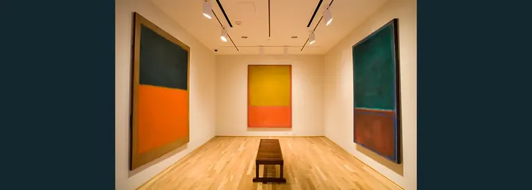 The Rothko Room at The Phillips Collection, with one Mark Rothko canvas on each wall and a wooden bench in the centre