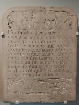 The carved stone funerary epitaph of Nicolas Flamel, held at the Musée de Cluny