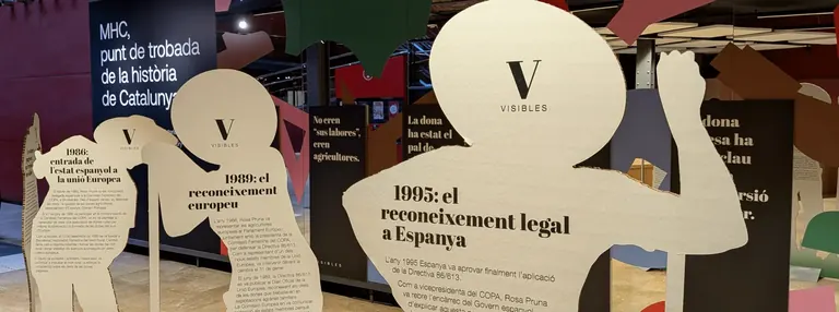 Cut-out silhouette panels with timeline texts in the exhibition Visibles