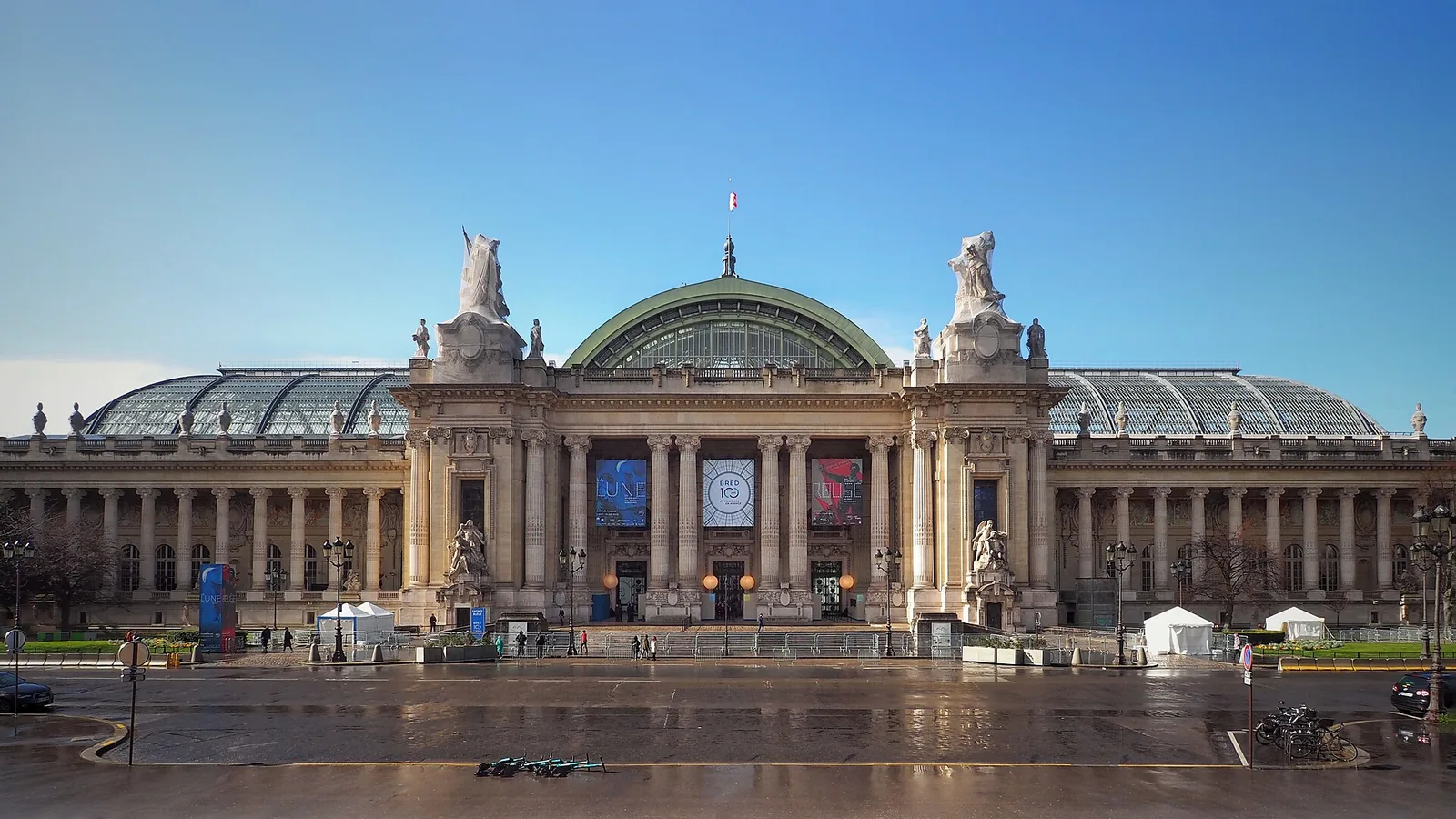 The Beaux-Arts stone facade and glass dome of the Grand Palais in Paris