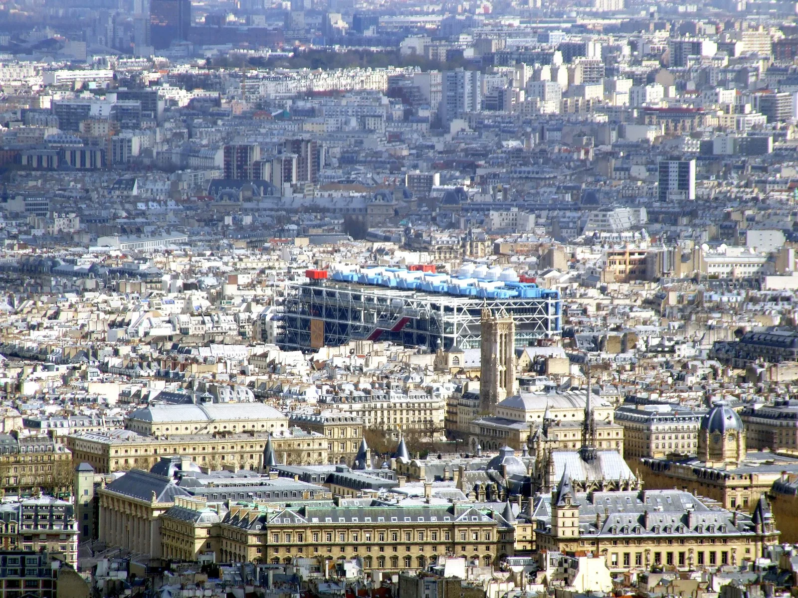 The Centre Pompidou's colourful inside-out facade seen across the Paris skyline from the Tour Montparnasse