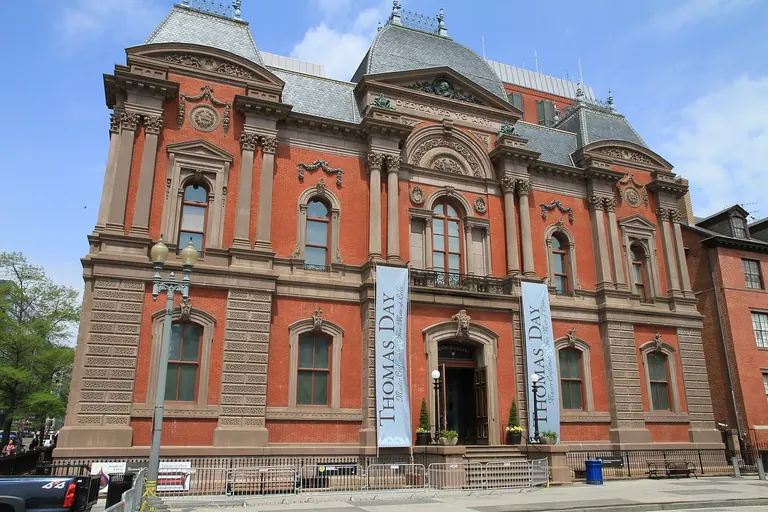 The red brick and sandstone Second Empire facade of the Renwick Gallery in Washington, DC, with mansard roofs and "Dedicated to Art" carved above the entrance