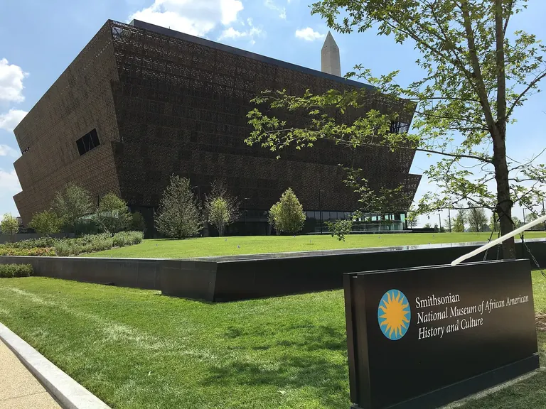 Exterior of the National Museum of African American History and Culture, its three-tiered bronze-coloured filigree corona seen from the National Mall