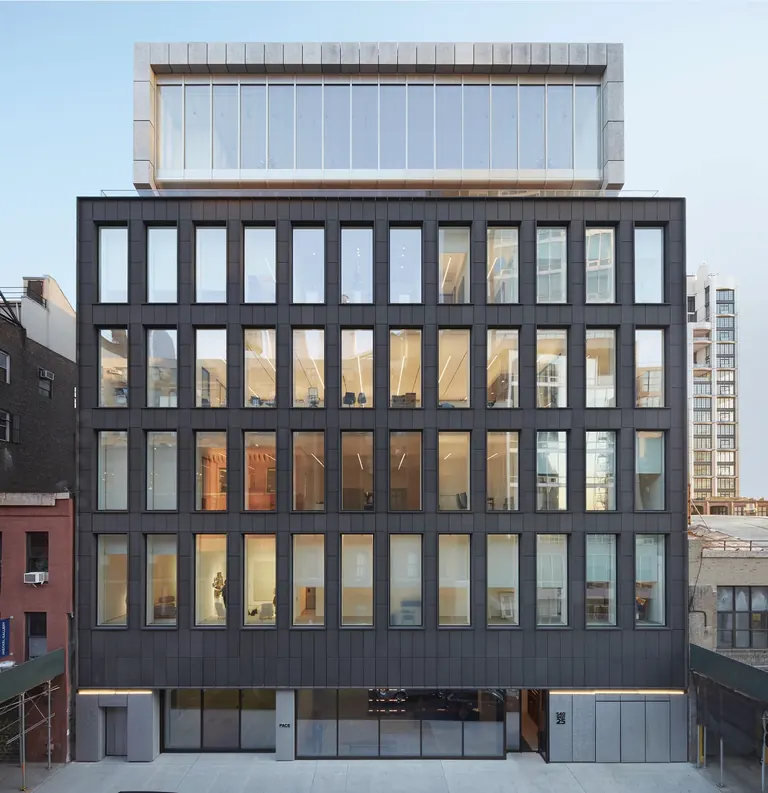 The Pace Gallery flagship at 540 West 25th Street, New York, an eight-story building clad in matte-black volcanic stone, at dusk