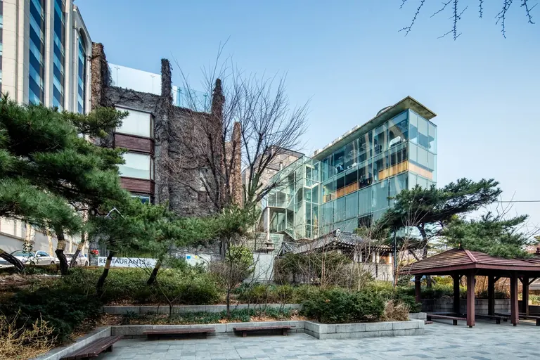 The ivy-covered brick exterior of the former Space Group Building, now Arario Museum in Space, in Seoul