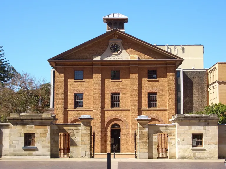 Georgian sandstone-trimmed brick facade of Hyde Park Barracks on Macquarie Street, Sydney