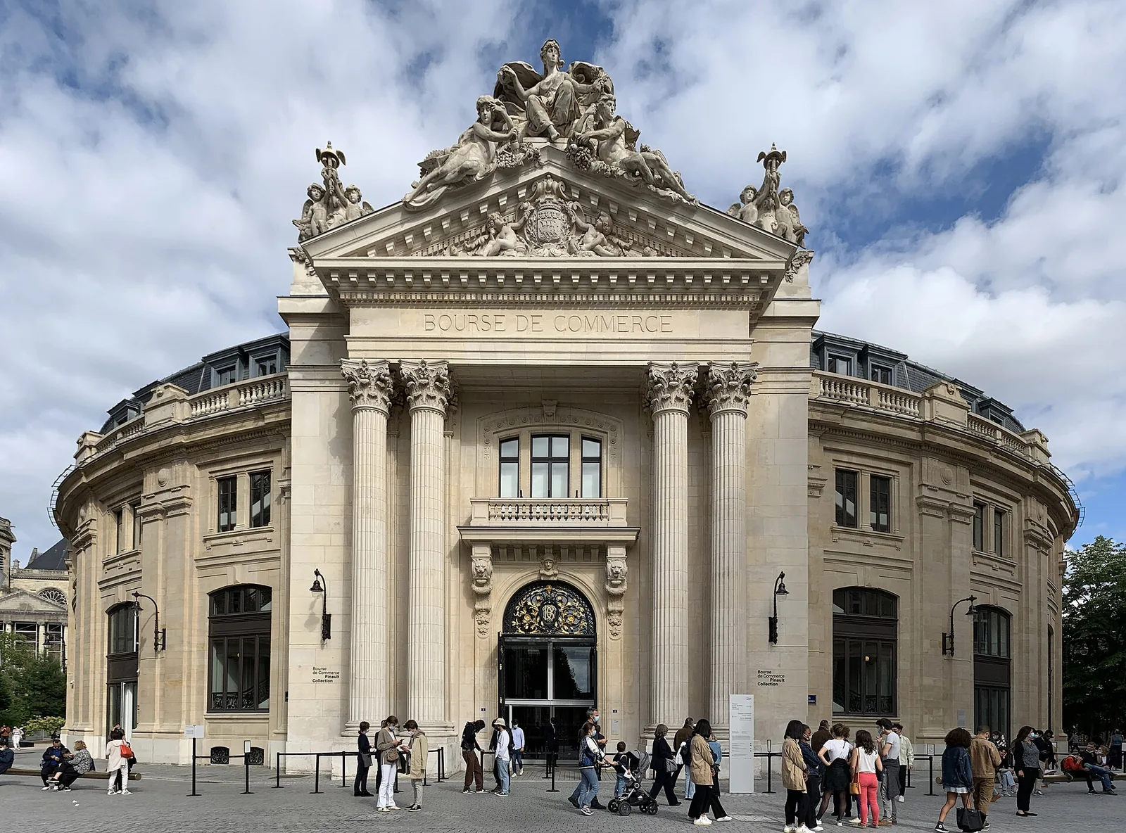 Exterior of the Bourse de Commerce, a circular 18th-century building with a copper-and-glass dome in central Paris
