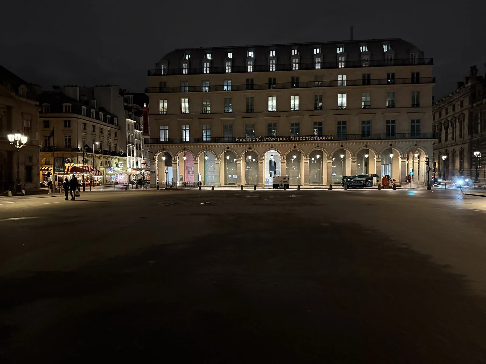 The Fondation Cartier pour l'art contemporain in its arcaded Second Empire building on place du Palais-Royal, Paris, at night