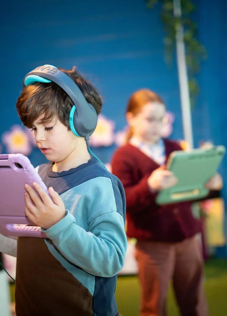 Child using a VR headset in the Eden and the Golden Rule exhibit at Jewish Museum junior