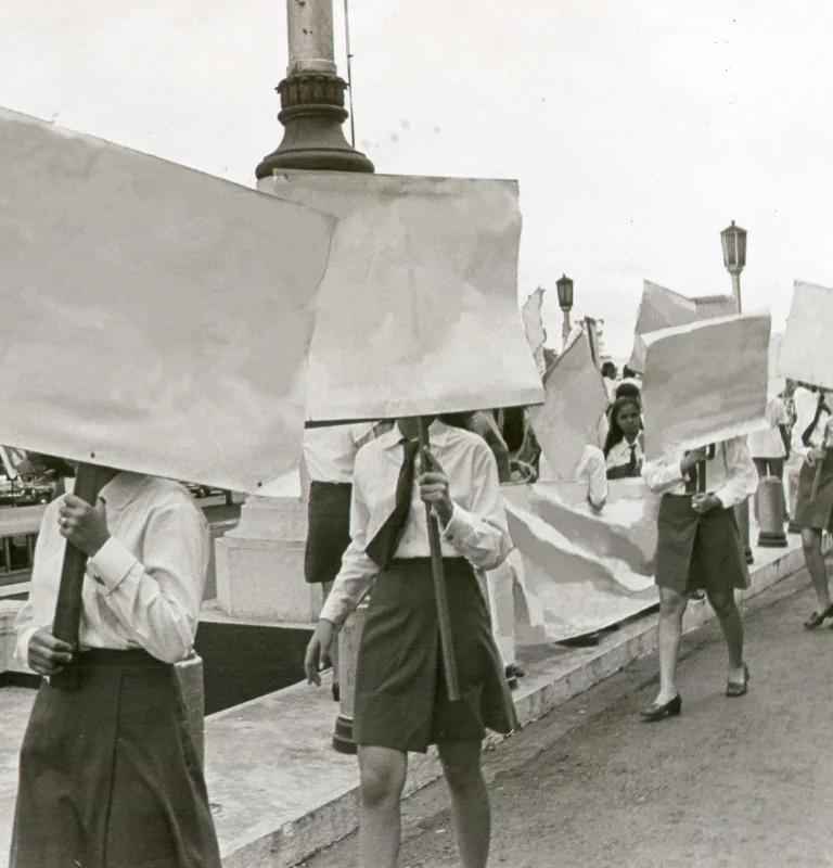 Kiri Dalena, archival photograph of young women with erased protest placards