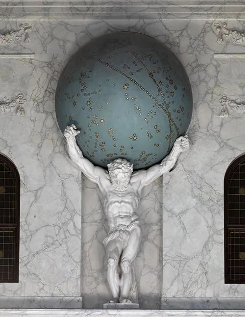 The statue of Atlas inside the Royal Palace Amsterdam