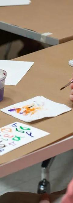 Participants in The Phillips Collection's Reframing Care programme making artwork together