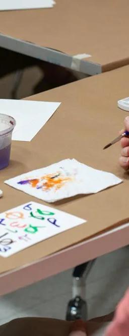 Participants in The Phillips Collection's Reframing Care programme making artwork together