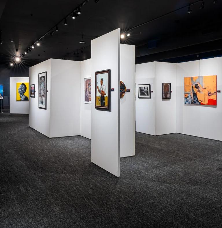 Visitors in the Black Creativity Juried Art Exhibition galleries at the Griffin Museum of Science and Industry