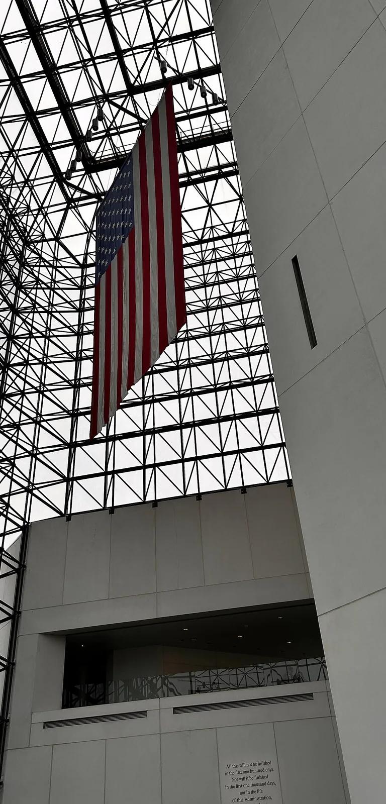 Interior of the glass Pavilion atrium at the John F. Kennedy Presidential Library and Museum, looking up through the steel lattice