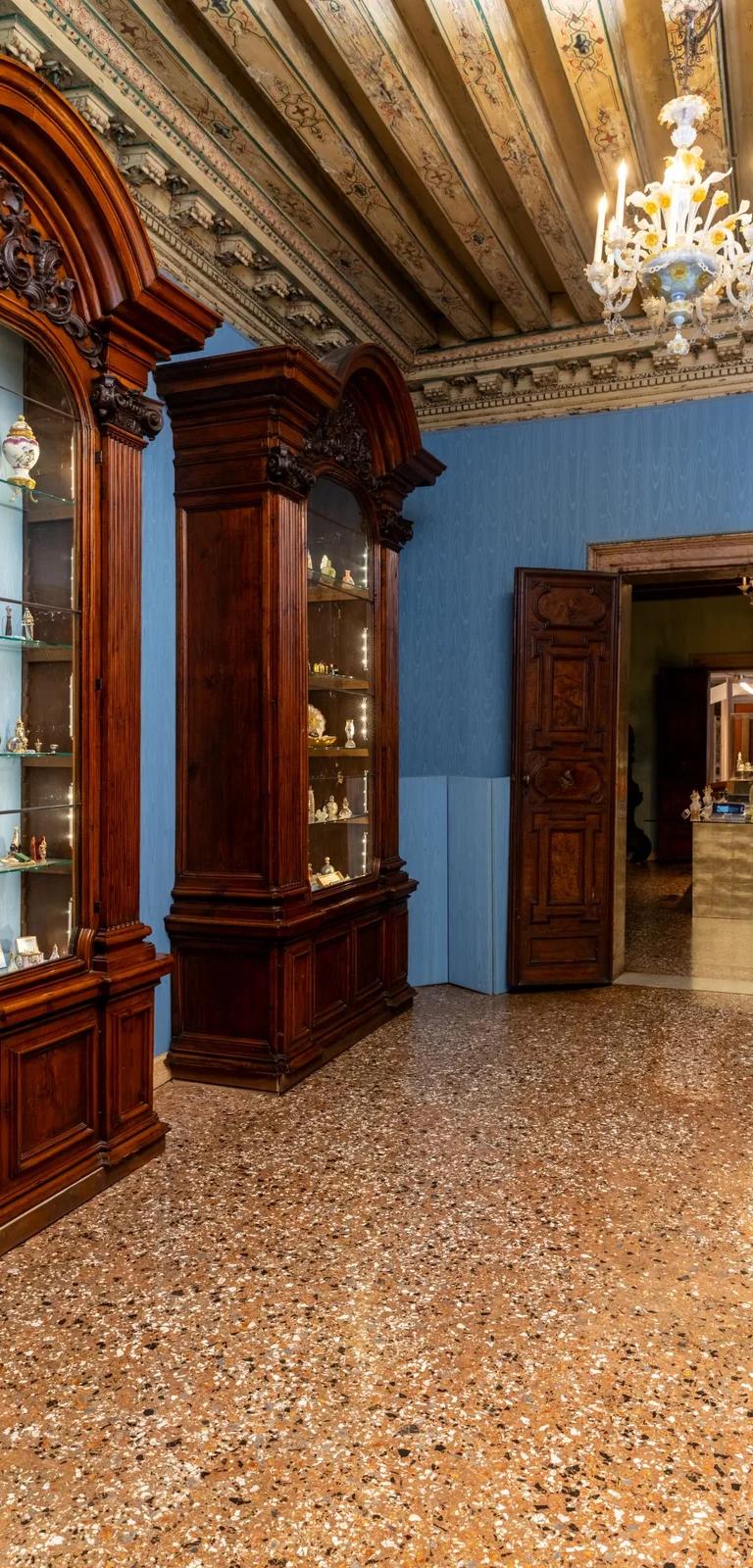 Room 16 of Palazzo Mocenigo with perfume bottles from the Storp Collection