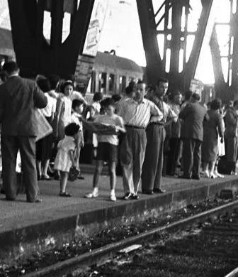 Federico Garolla photograph of Ferragosto at Milan station, exhibition banner