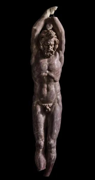 Red-violet marble statue of Marsyas at Centrale Montemartini
