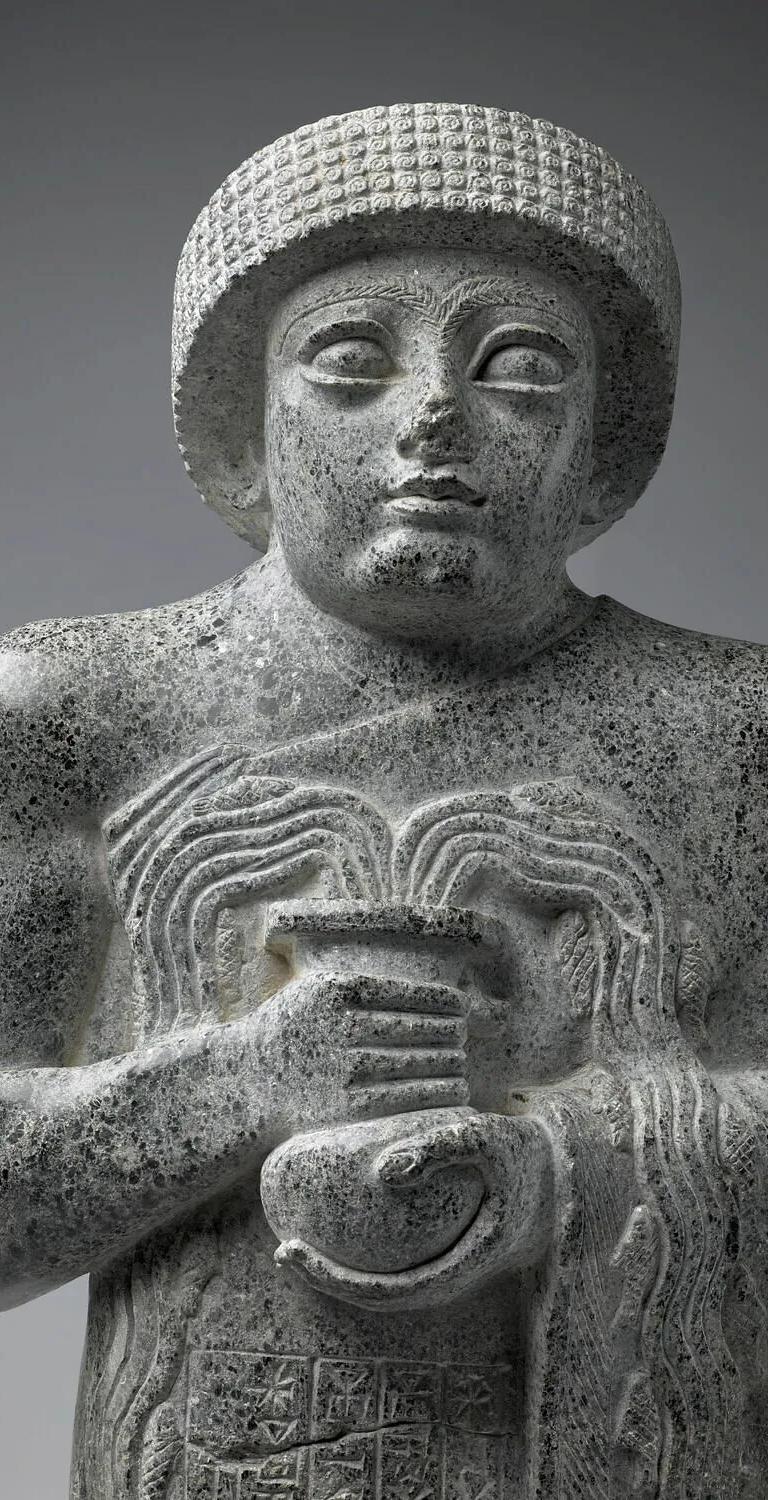 Gudea with the flowing vase, a Mesopotamian statue in the Primeval Waters exhibition