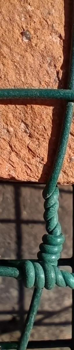 A rock with a green net in front of it