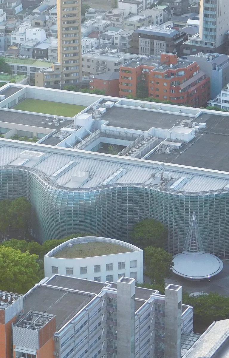 The wave-shaped glass facade of The National Art Center, Tokyo