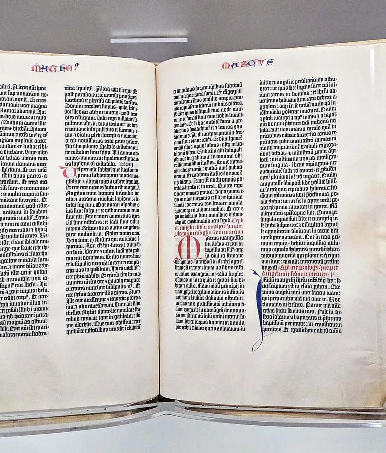 The Library of Congress copy of the Gutenberg Bible open in its display case in the Great Hall of the Thomas Jefferson Building
