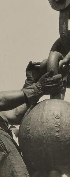 Lewis Hine photograph of a worker riding a wrecking ball high above the city