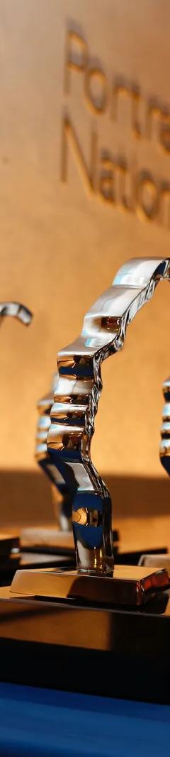 Gold Portrait of a Nation award trophies shaped as a face in profile