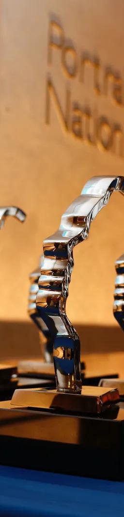 Gold Portrait of a Nation award trophies shaped as a face in profile