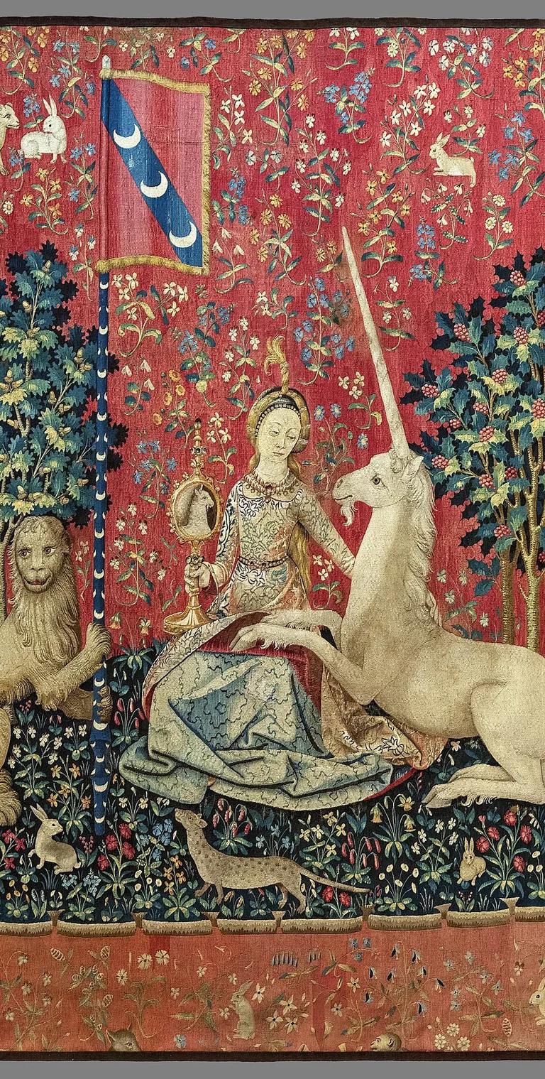The Sight panel of the Lady and the Unicorn tapestry, the unicorn gazing into a mirror