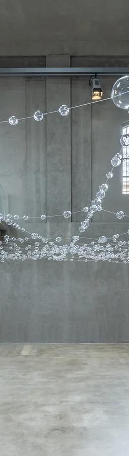 Mona Hatoum's Over, under and in between installation in the Cisterna, Fondazione Prada