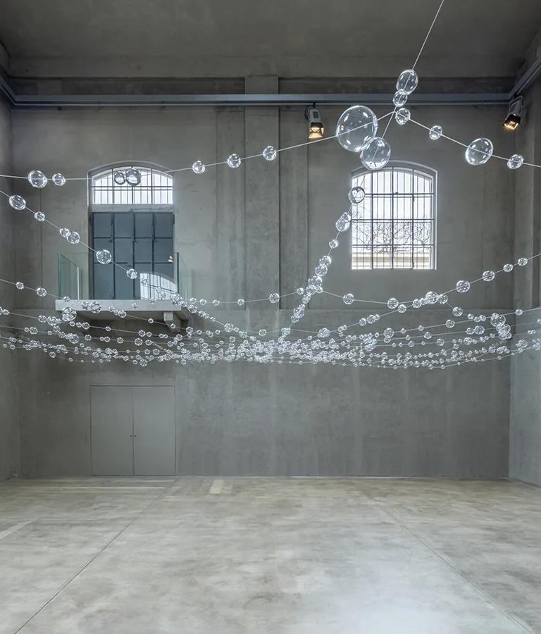 Mona Hatoum's Over, under and in between installation in the Cisterna, Fondazione Prada
